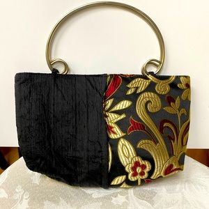 Artisan hand bag in black/wine/gold. Satin finish 10x6x2.5. Perfect condition